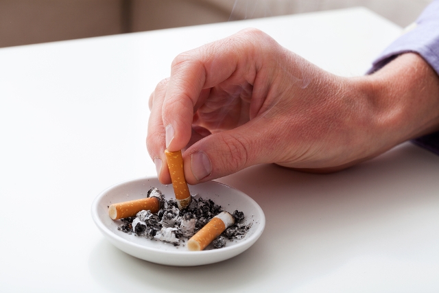 stubbing cigarette ashtray