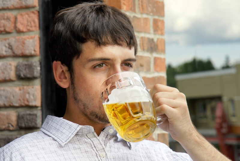 young man drinking beer