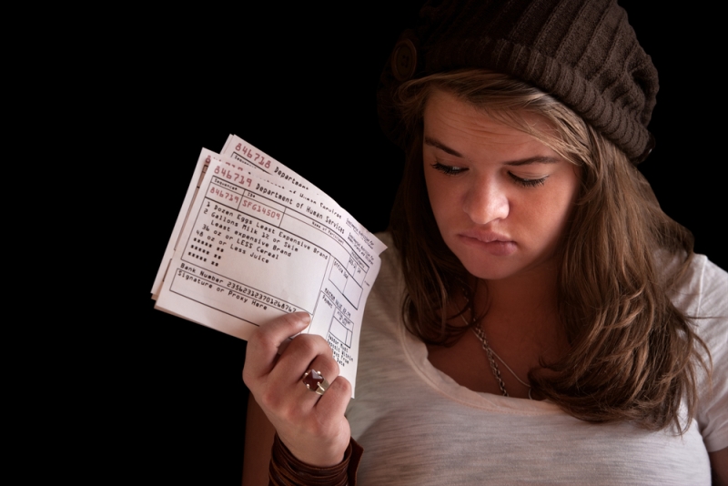 young woman food coupons