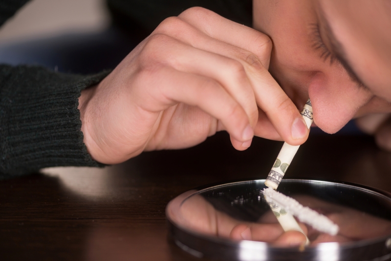 Man snorting cocaine