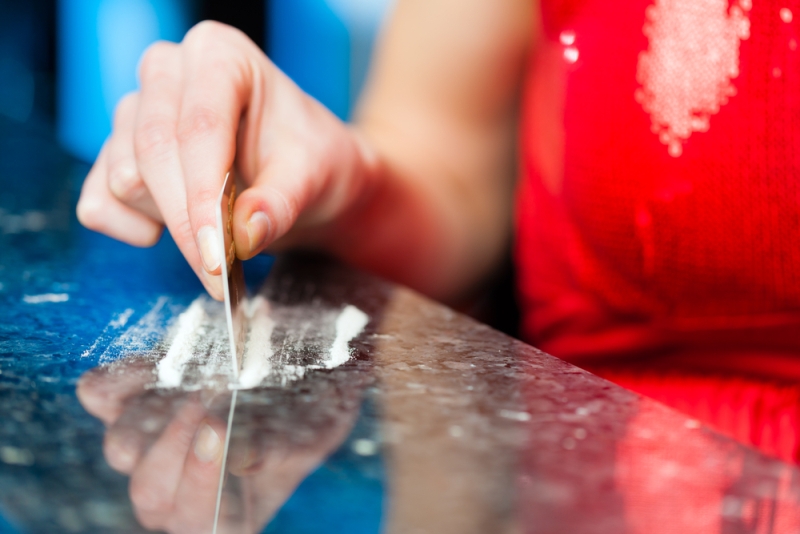 woman chopping cocaine