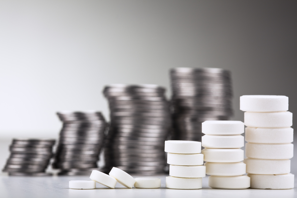 Stacks of coins and pills.