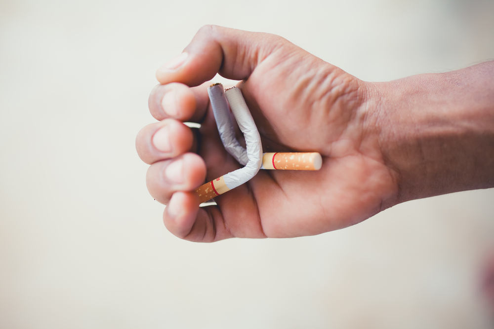 Ask an Expert: I Quit Pot, But Now I’m Smoking More Than Ever A hand crushing cigarettes