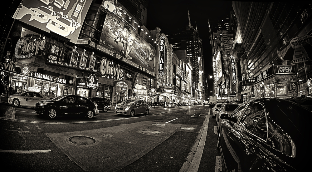 Black and white image of Times Square at night.