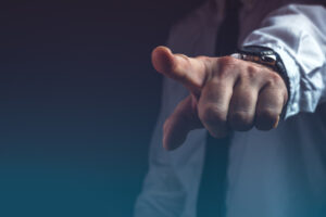 A finger pointing accusingly at the camera