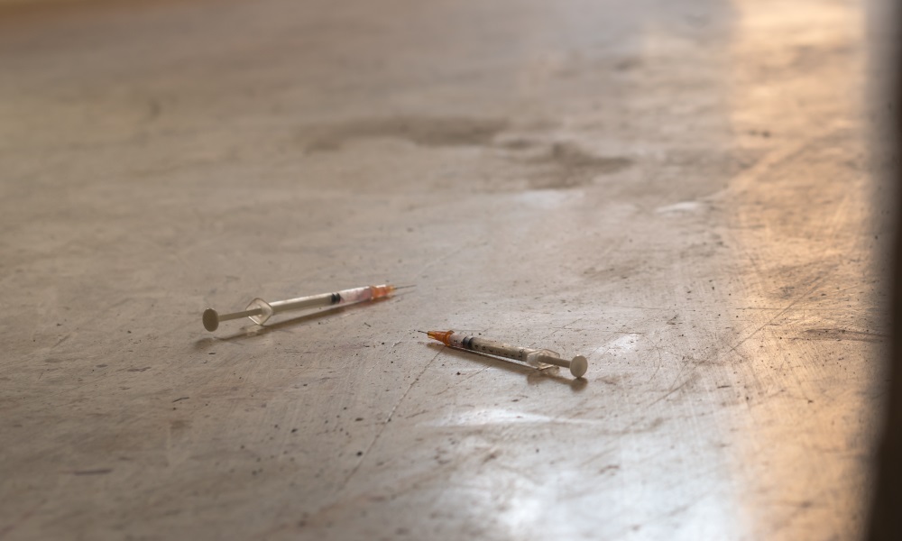 2 syringes on the floor.