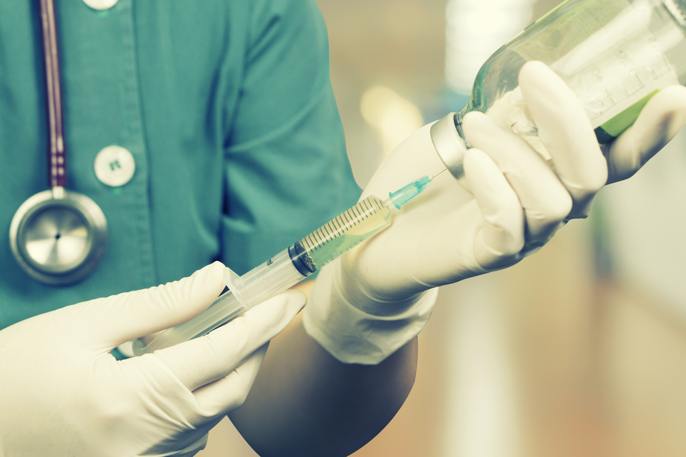 Doctor preparing injection.