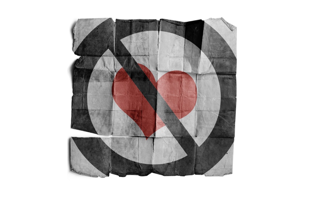 A rumpled piece of paper with a banned heart image.