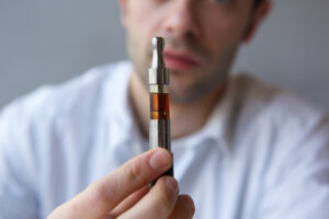 Man holding e-cigarettes