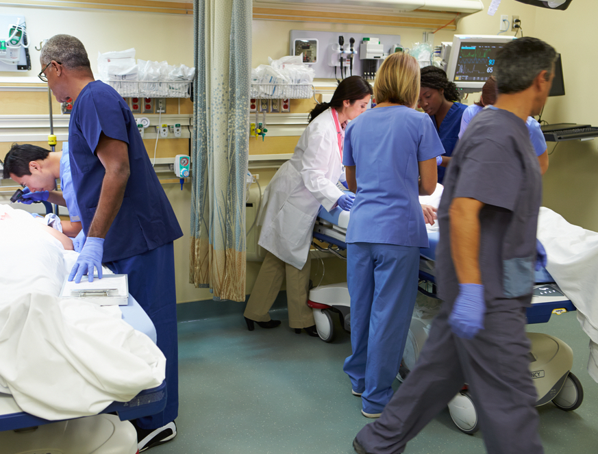 Doctors inside an emergency room.