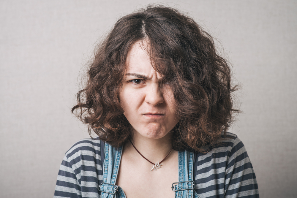 A woman with a grumpy face