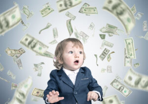 A child surrounded by flying dollar bills.