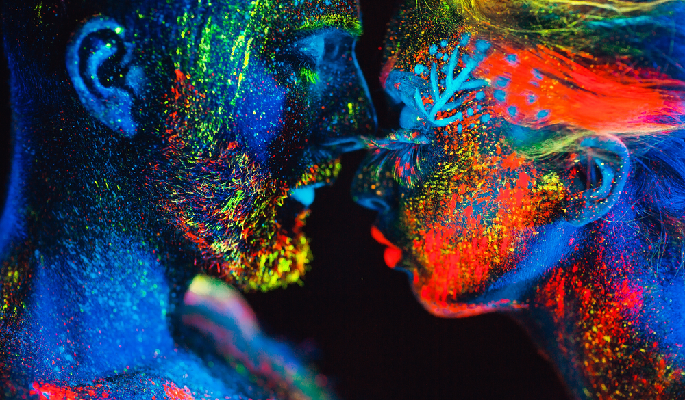 Portrait of a pair of lovers painted in fluorescent powder.