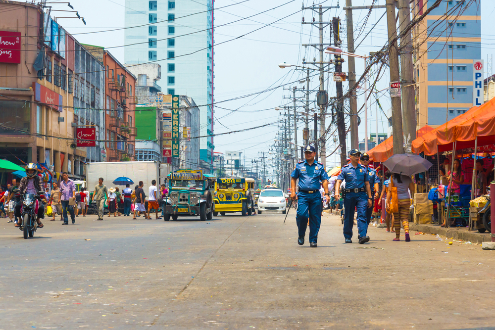 Police officers patrol Divisoria Market in Manila on April 27, 2014.