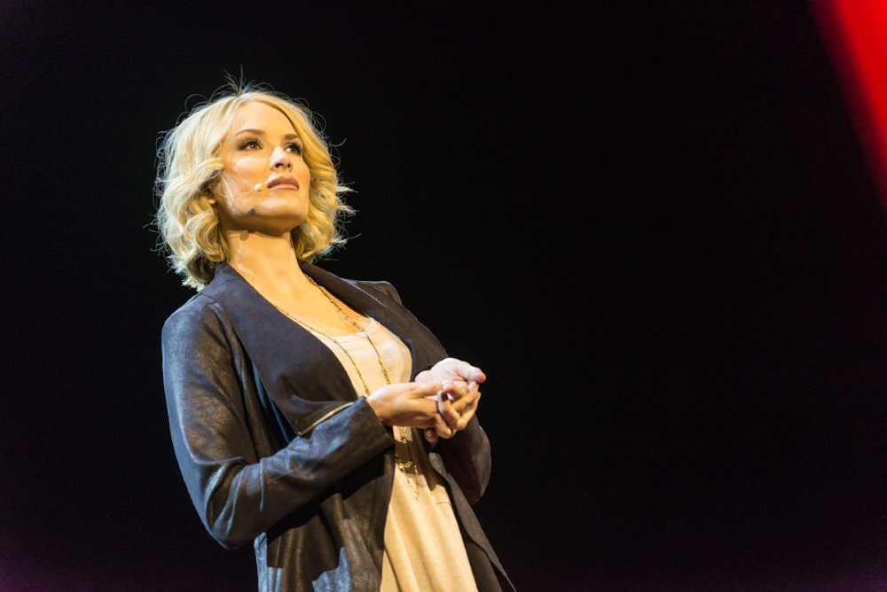 Tara Conner speaking in public.