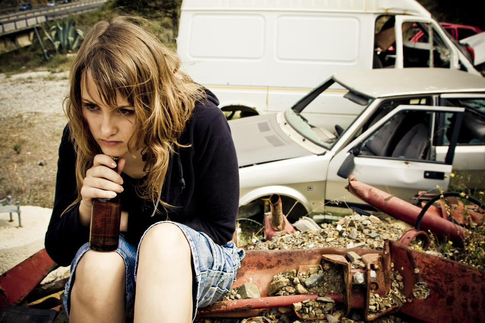 A stressed woman with beer.