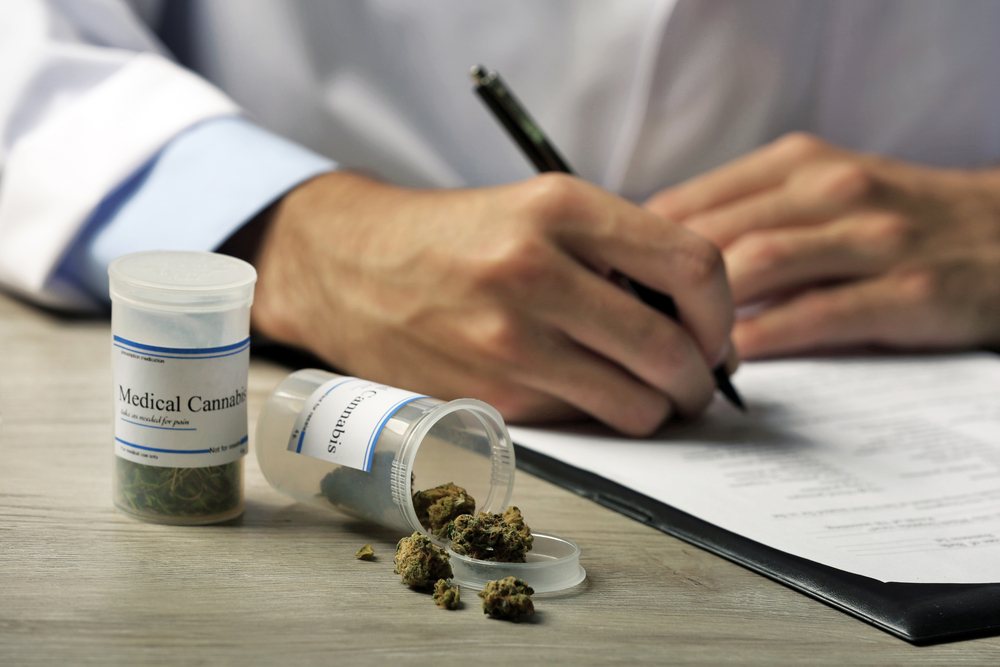 A doctor writing a prescription for medical marijuana.