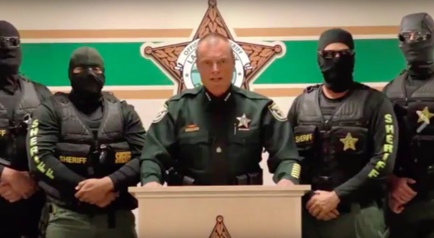 Lake County Sheriff Peyton Grinnell and four masked officers.