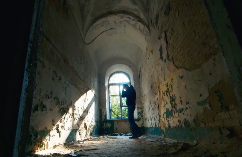 New Anxiety Documentary Sheds Light On Nature Of The Disorder Man dressed in black pacing inside isolated room while battling effects of anxiety.