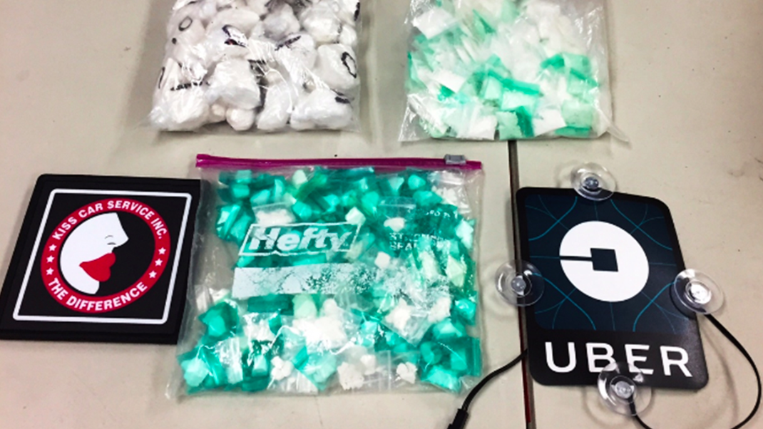 cocaine and fake ride-sharing placards that were confiscated by law enforcement.