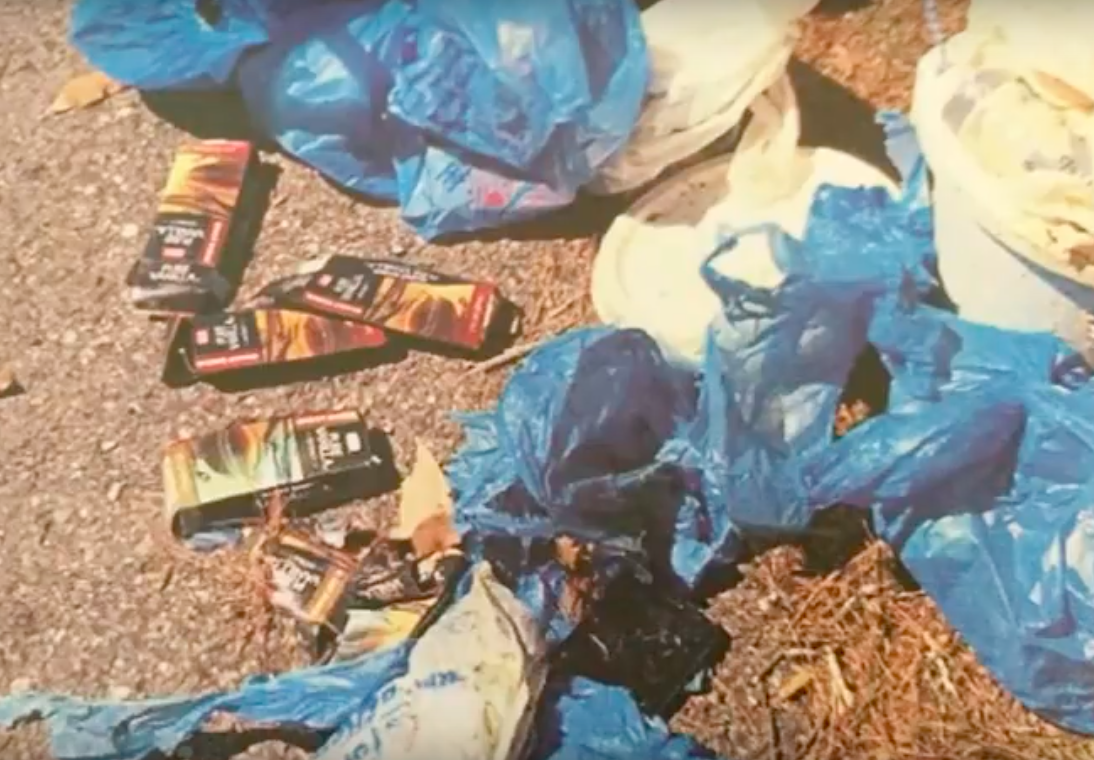 A pile of litter featuring empty containers of vanilla extract.