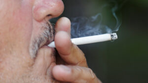 Close up of man smoking a cigarette