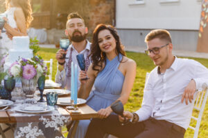 Guests sitting at table during wedding celebration