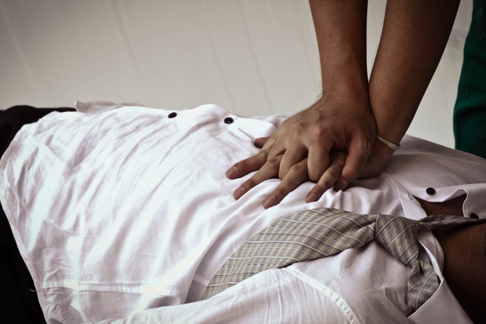 CPR on an unconscious man.