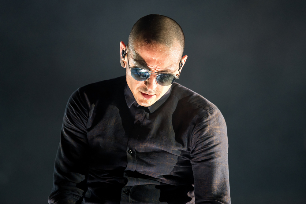 Chester Bennington wearing shades looking downwards