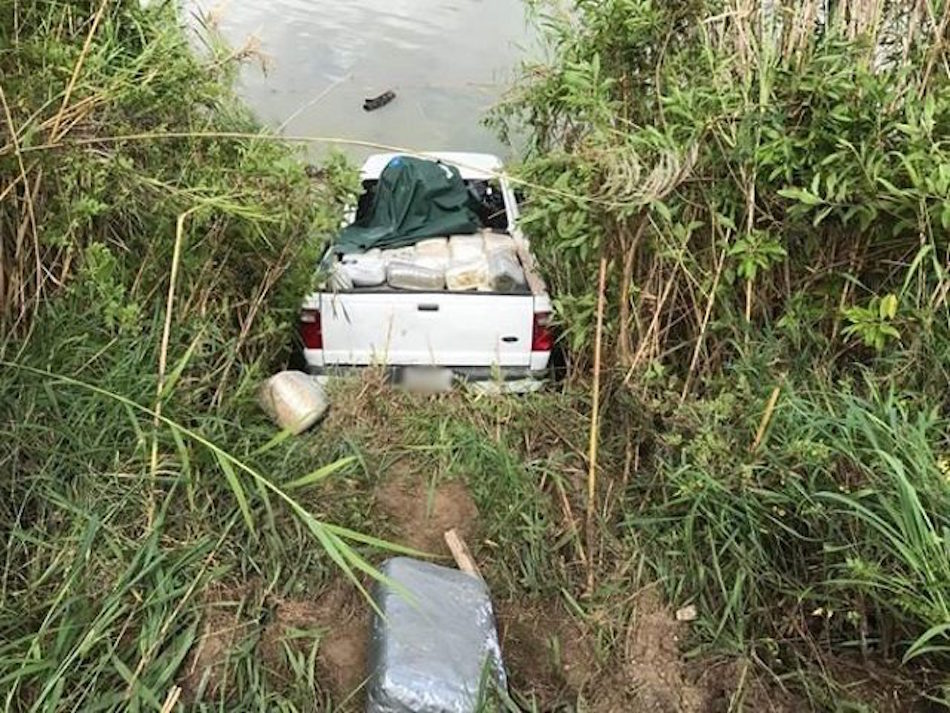 pickup truck stuck in riverbed