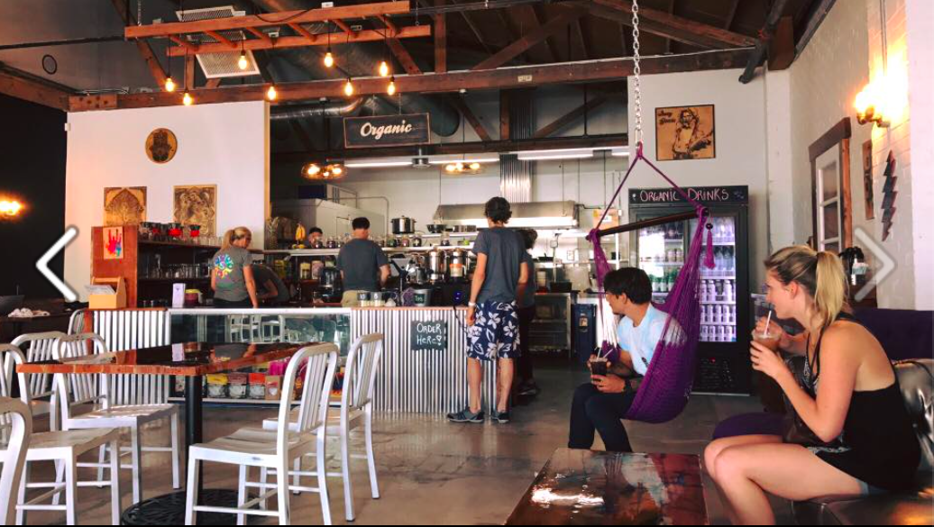 customers enjoying drinks inside Enlightened Cafe