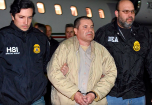 El Chapo being escorted by federal officials