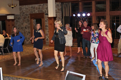 Anne and a group of friends dancing.