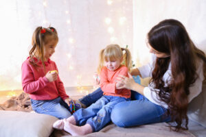 mom playing with her daughters