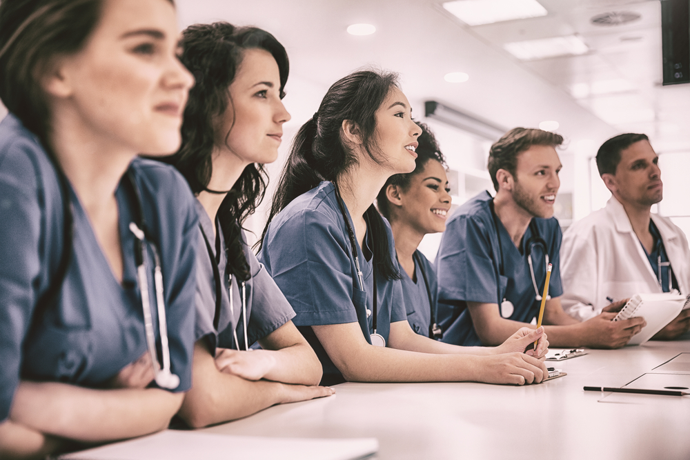 Medical students listening sitting at desk at the university