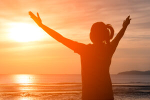 happy woman at sunset