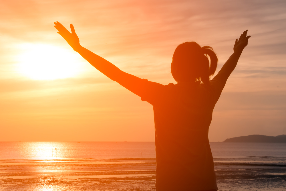 happy woman at sunset