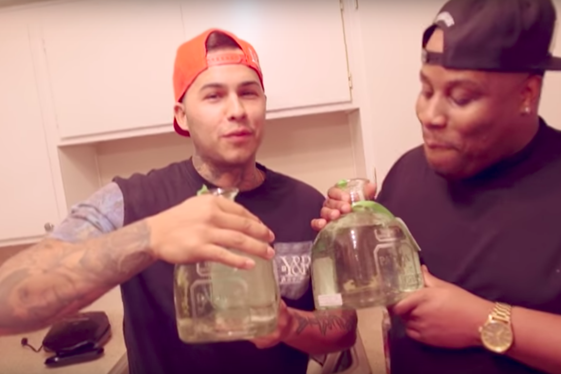 YouTubers in a chugging challenge video drinking tequila Patron.