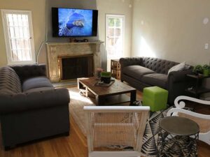 A living room with TV on wall