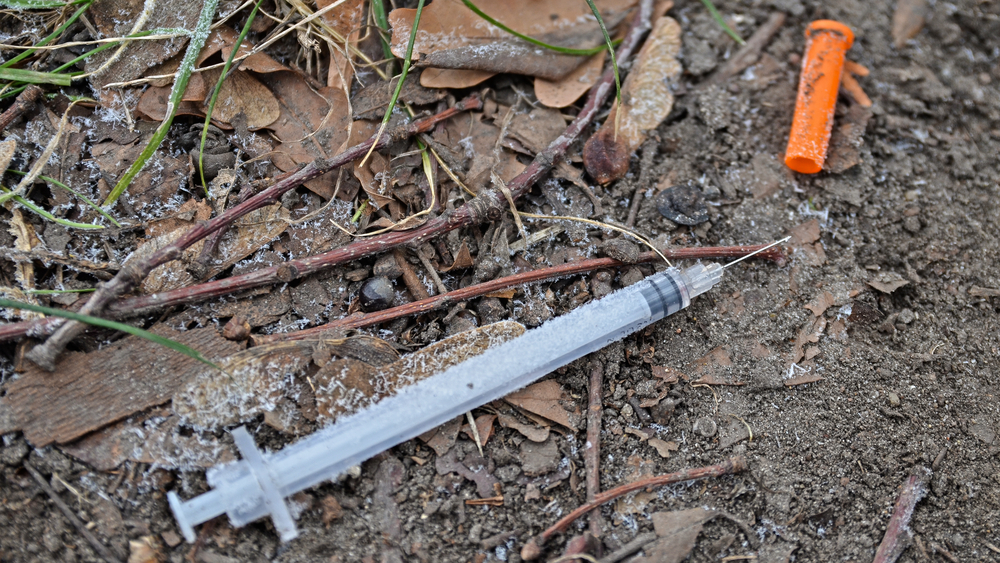 empty injection syringe and needle