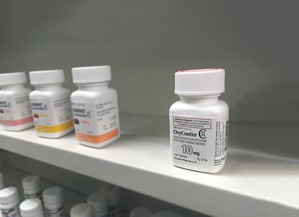 Oxycontin bottle on shelf in the pharmacy. Oxycontin is known in the news to be a cause of pain killer overdose and addiction