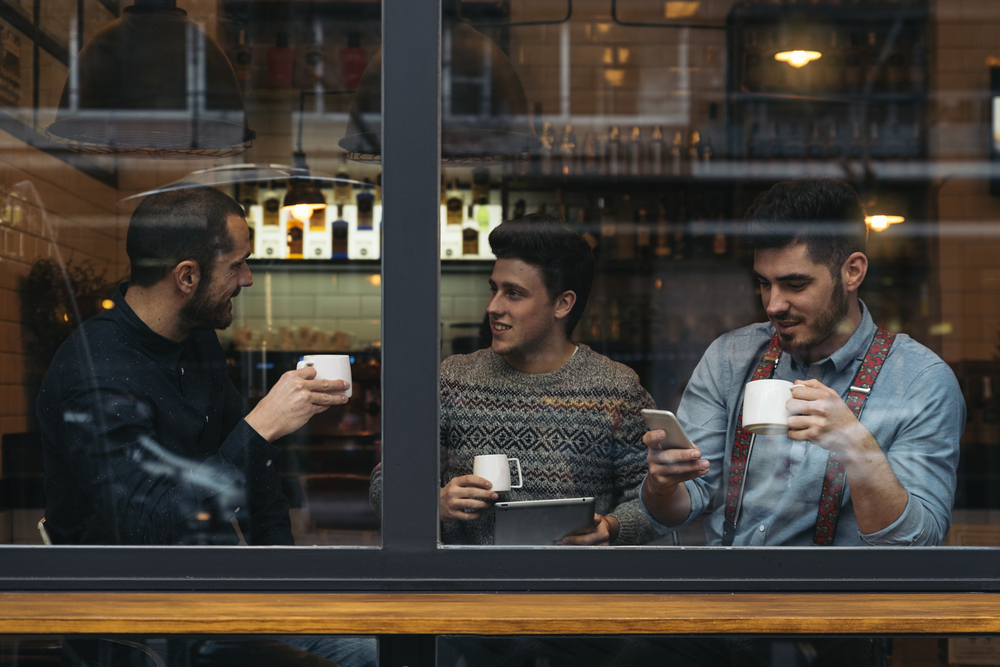 Friends hanging out in a coffee shop.