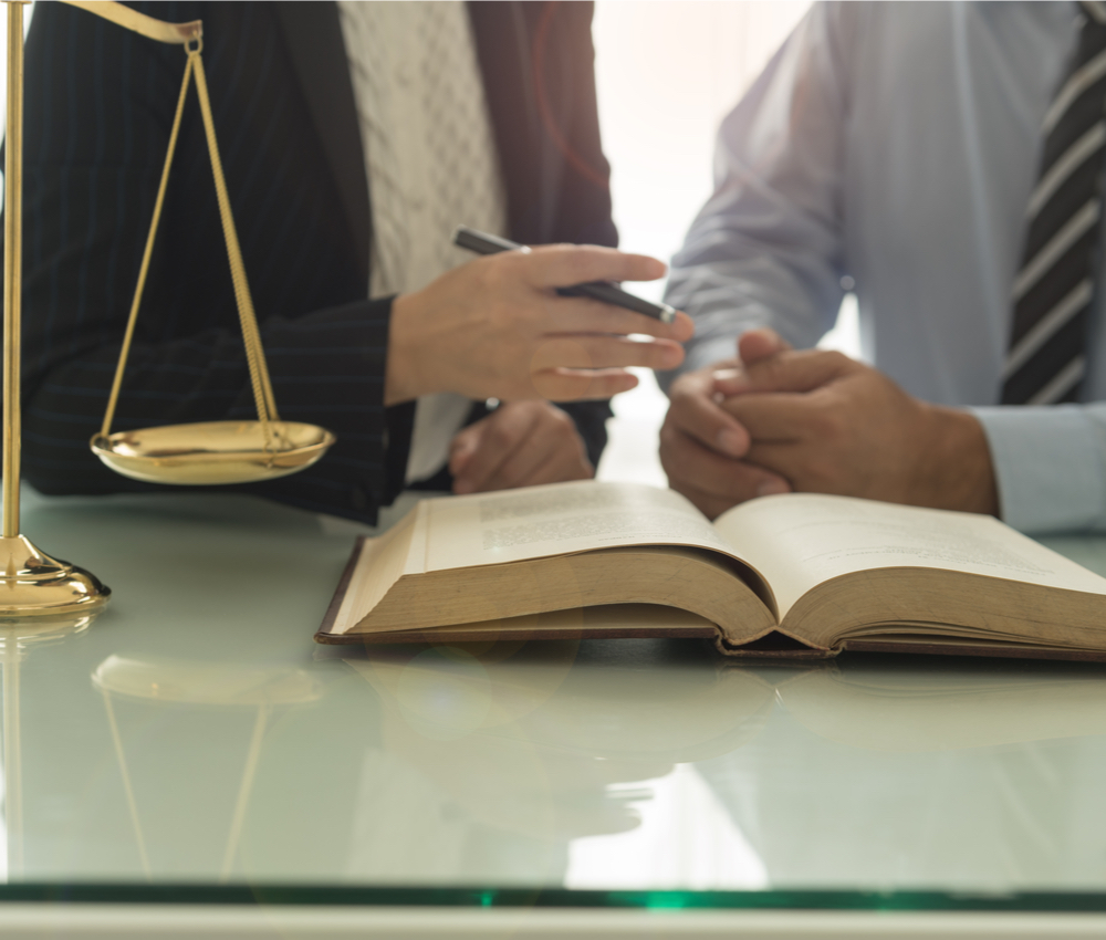 Lawyer and attorney having team meeting at law firm