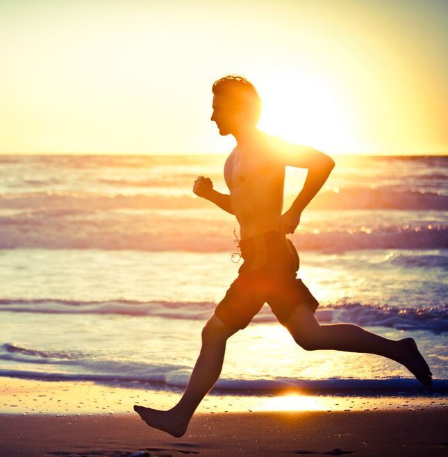 A man running on the beach.