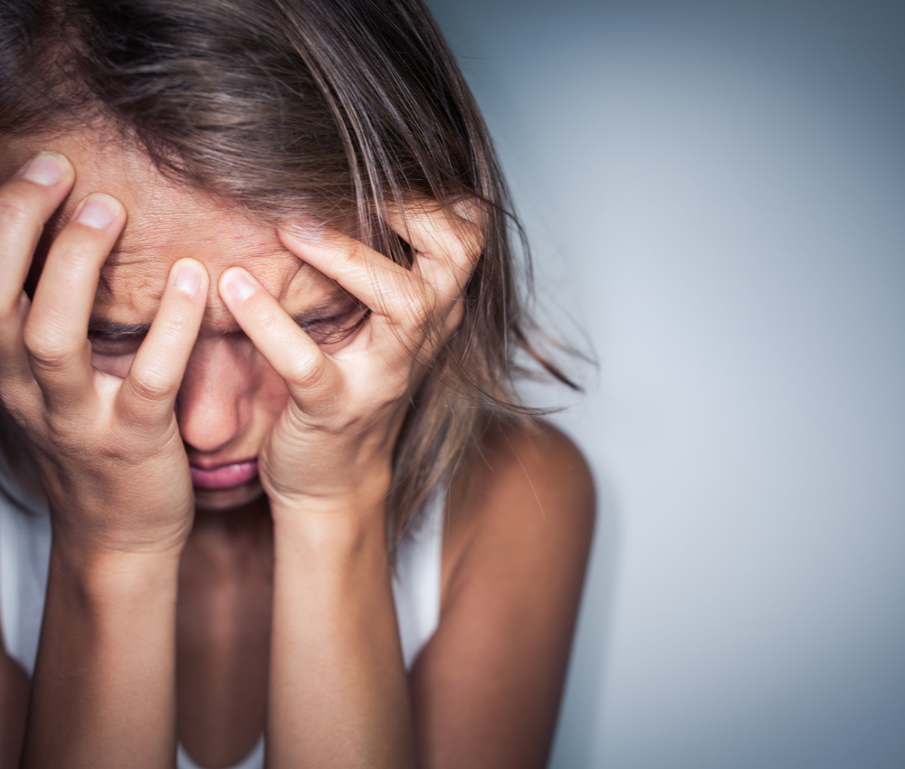 Young woman suffering from anxiety/sudden fear