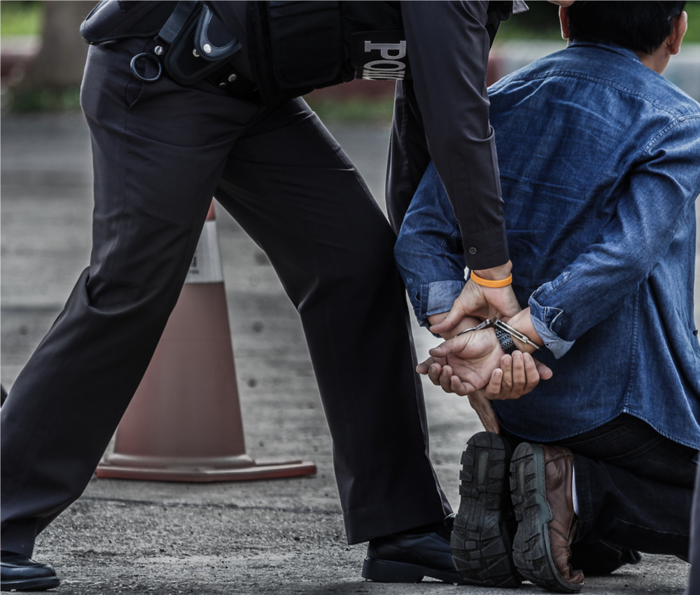 police arresting man