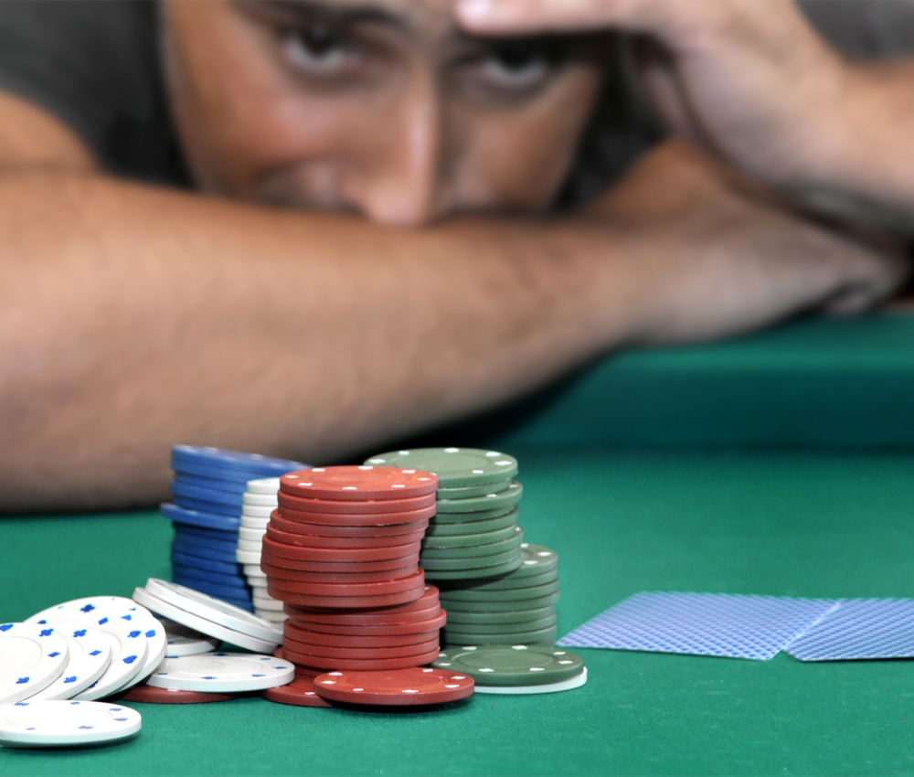 stressed man playing poker