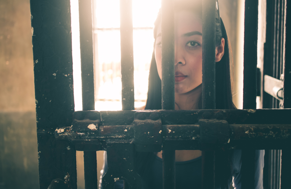 woman behind bars