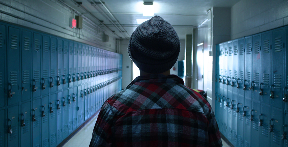 Student walking down hallway