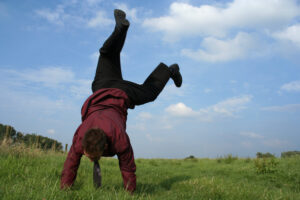 a businessman doing a cartwheel